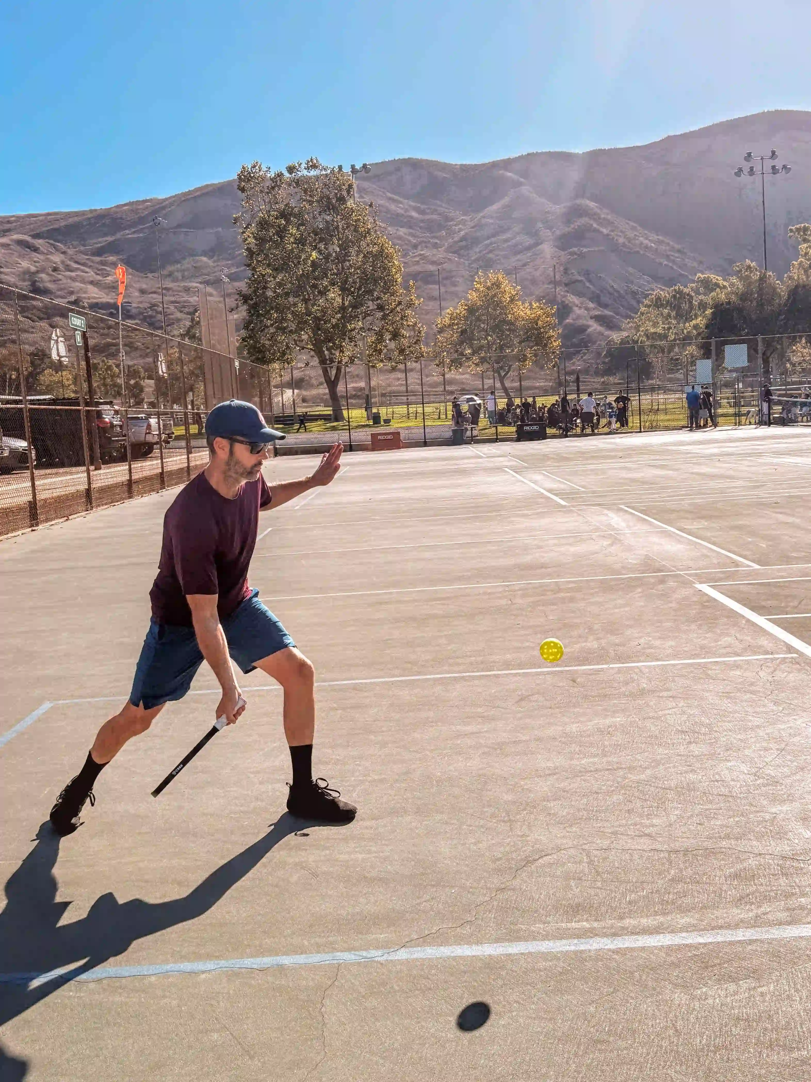 coach Brian playing pickleball